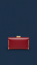 Crimson accent leather clutch