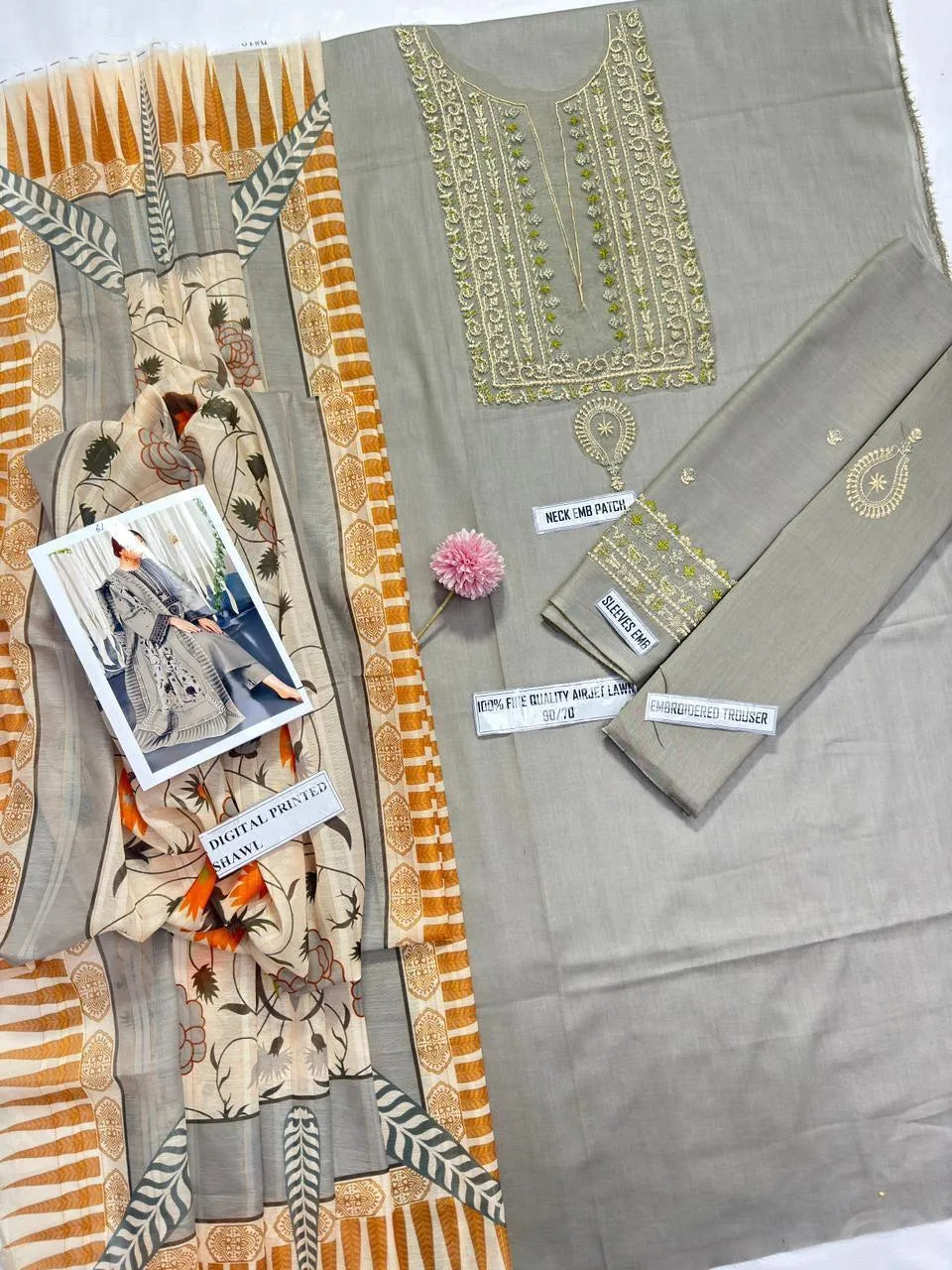 Elegant grey lawn suit featuring  intricate embroidery throughout