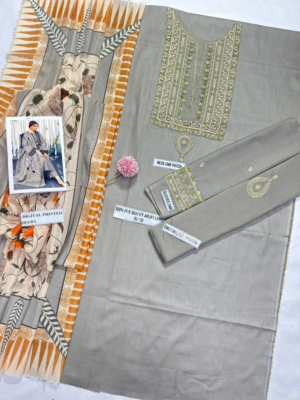 Elegant grey lawn suit featuring  intricate embroidery throughout